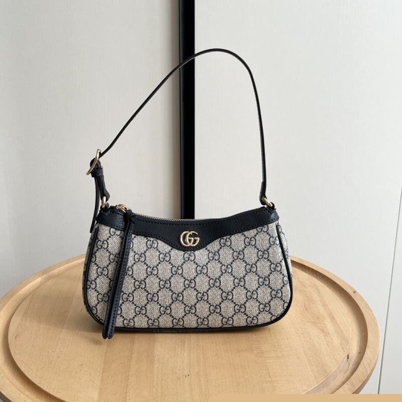 G*u*i top handle bags